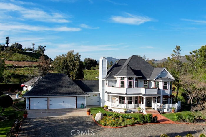 39460 Hilt Road Temecula, CA 92591 - Photo 73 of 74 a front view of a house with a garden