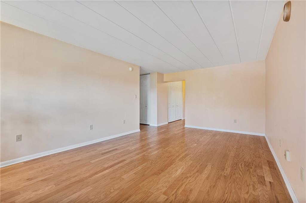5 Bayard Road, Unit 221 Pittsburgh, PA 15213 - Photo 8 of 20 a view of an empty room and wooden floor