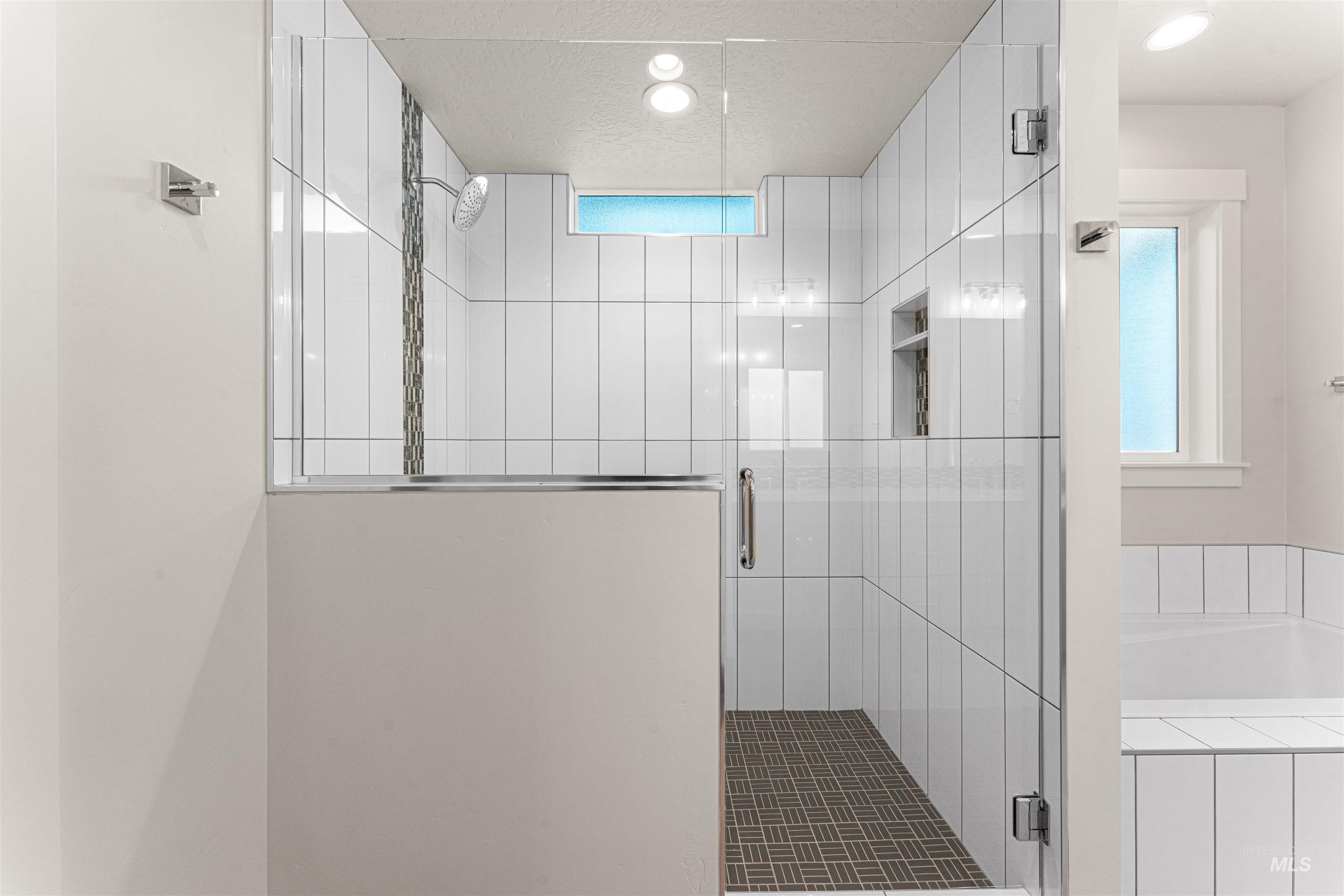 8080 Tandy Cv Street Middleton, ID 83644 - Photo 20 of 35 Bathroom featuring a shower stall, a bath, plenty of natural light, and recessed lighting