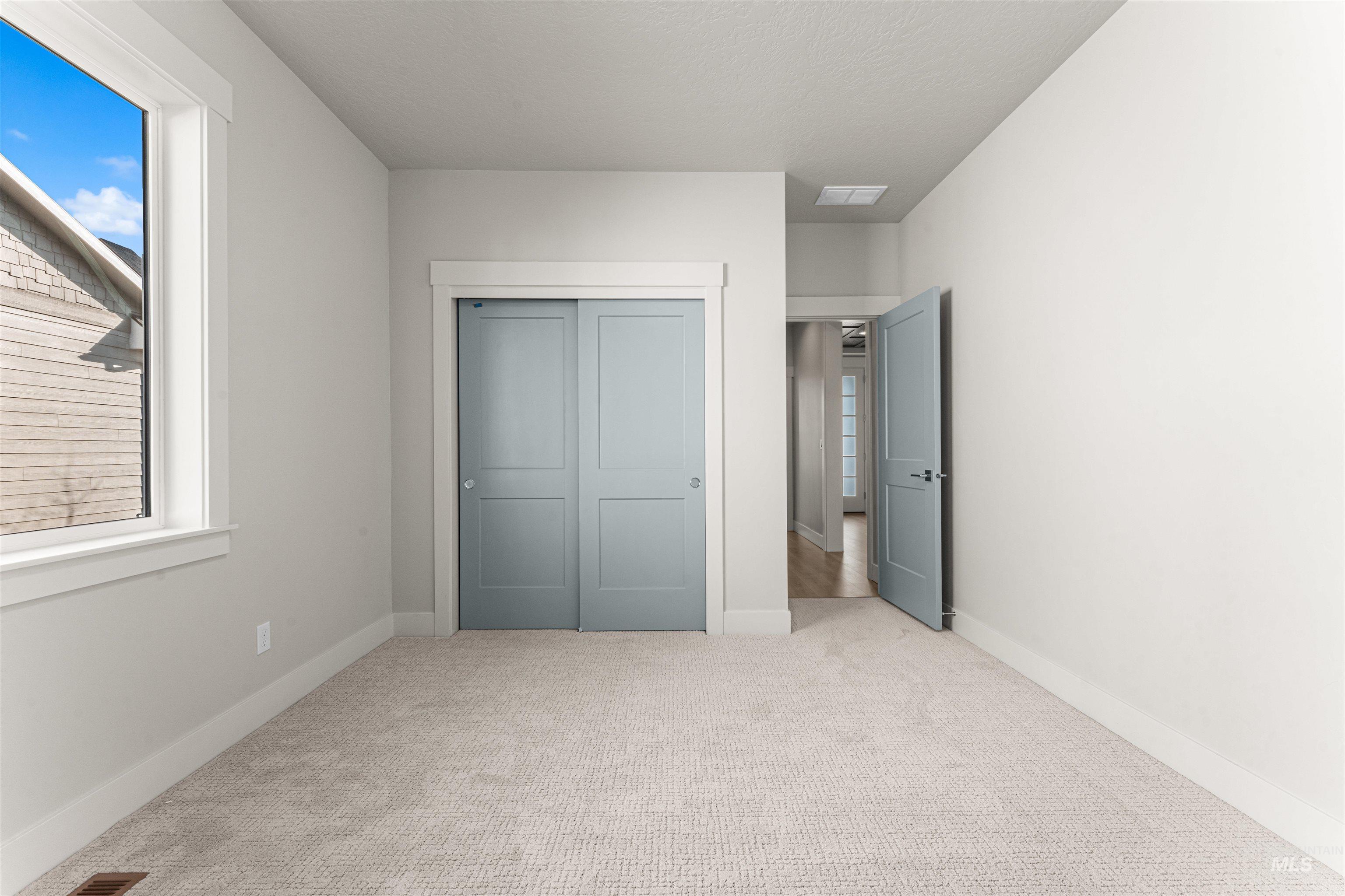8080 Tandy Cv Street Middleton, ID 83644 - Photo 28 of 35 Unfurnished bedroom featuring carpet floors and a closet