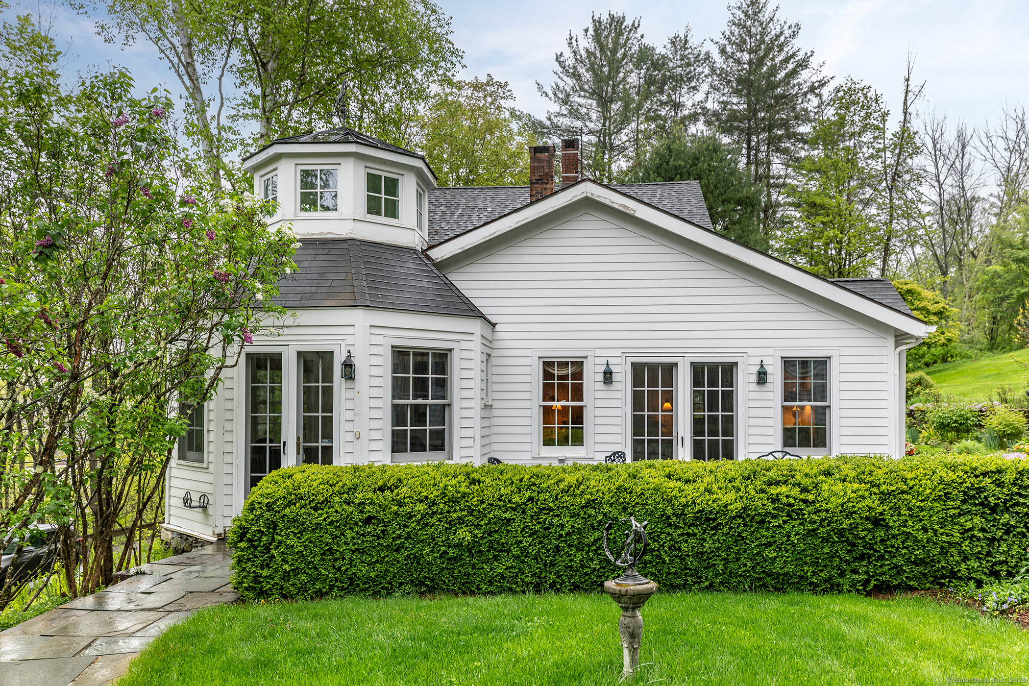 a front view of a house with a yard