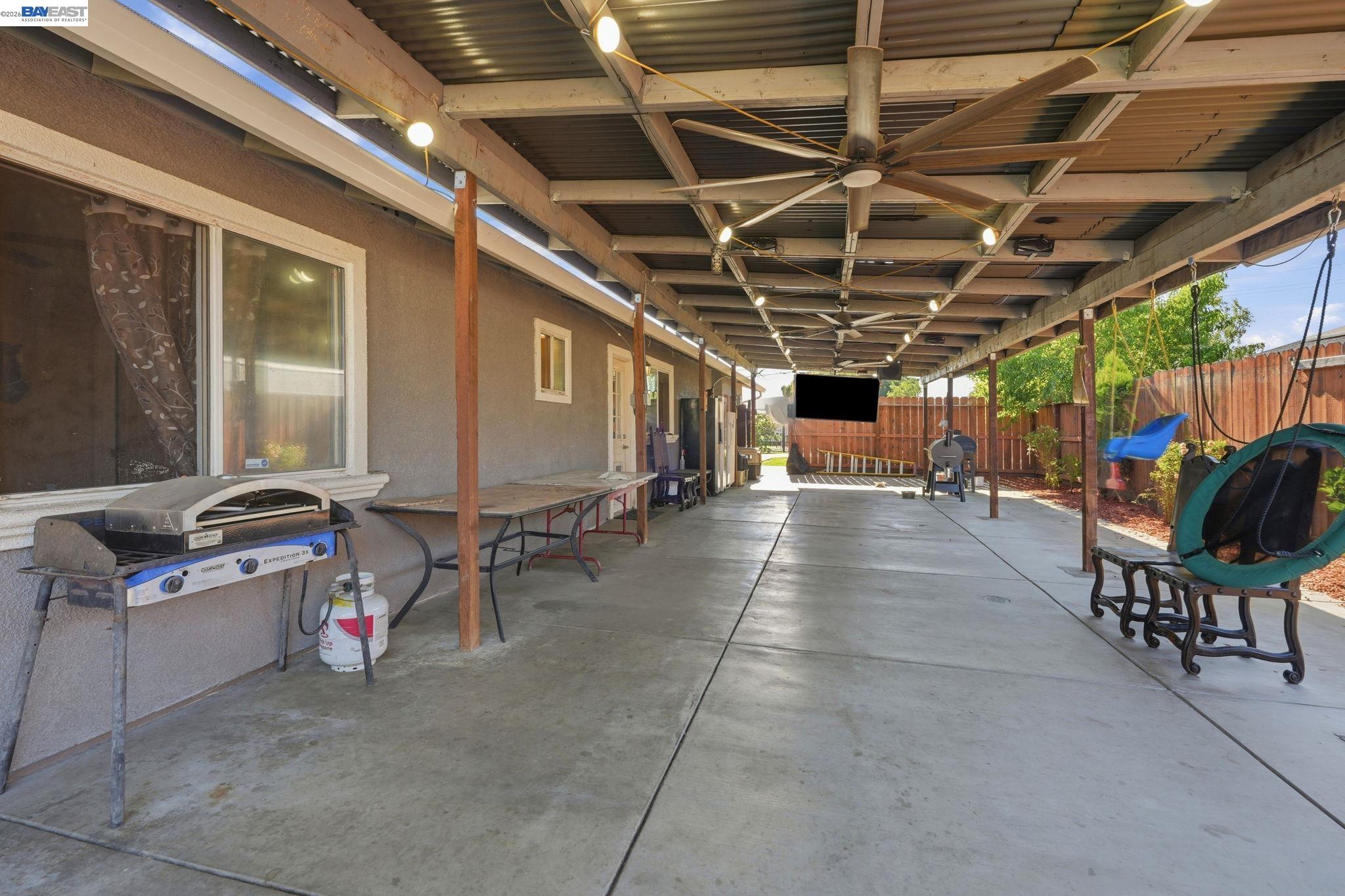10378 South Priest Road French Camp, CA 95231 - Photo 37 of 44 a view of a chairs and table in the patio