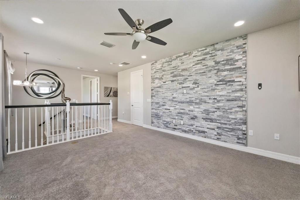 4172 Crescent Court Naples, FL 34119 - Photo 20 of 46 a view of a hallway with wooden floor