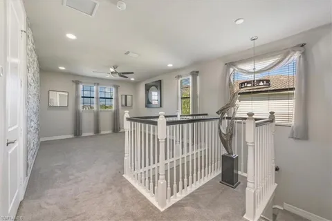 a view of a hallway with windows