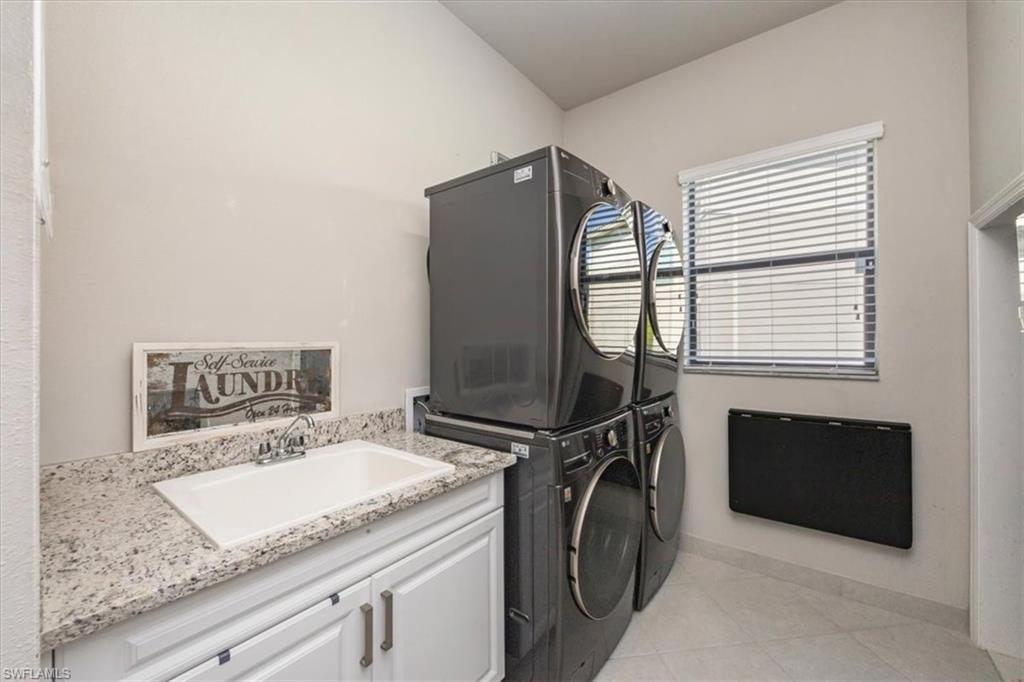 4172 Crescent Court Naples, FL 34119 - Photo 28 of 46 a utility room with dryer and washer