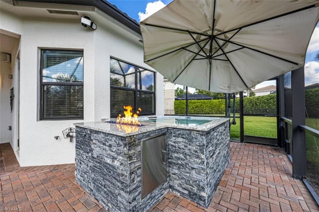 4172 Crescent Court Naples, FL 34119 - Photo 30 of 46 a view of swimming pool with a patio