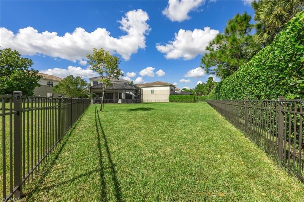 4172 Crescent Court Naples, FL 34119 - Photo 35 of 46 a view of a house with a big yard