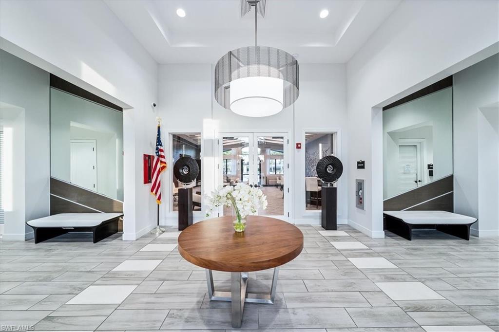 4172 Crescent Court Naples, FL 34119 - Photo 42 of 46 a view of a dining room with furniture
