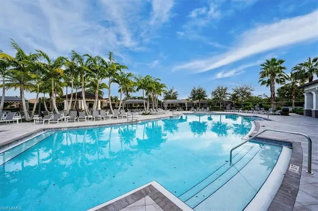 a view of a swimming pool with a yard