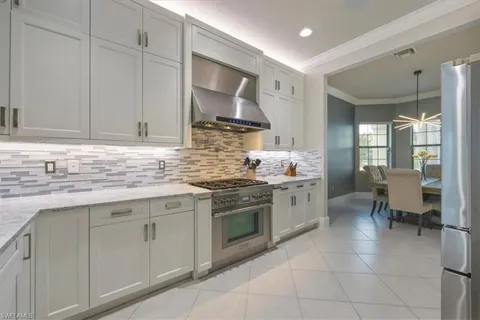 a kitchen with stainless steel appliances granite countertop a sink and cabinets