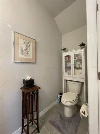 a bathroom with a sink toilet and mirror