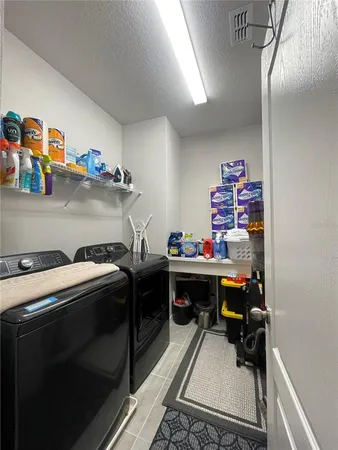 a bathroom with a granite countertop sink mirror and shower