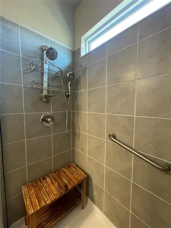 a bathroom with a granite countertop sink a toilet and a mirror