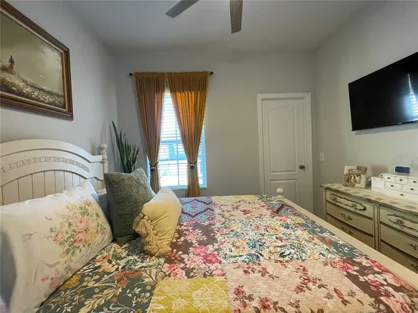 a bedroom with a bed and window