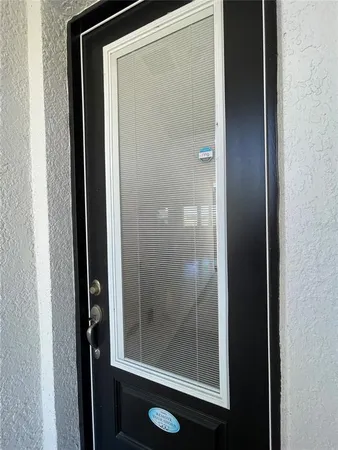 a bathroom with a glass shower door