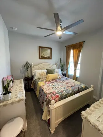 a view of a patio with table and chairs under an umbrella with wooden floor