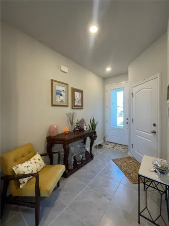 a living room with furniture and a window