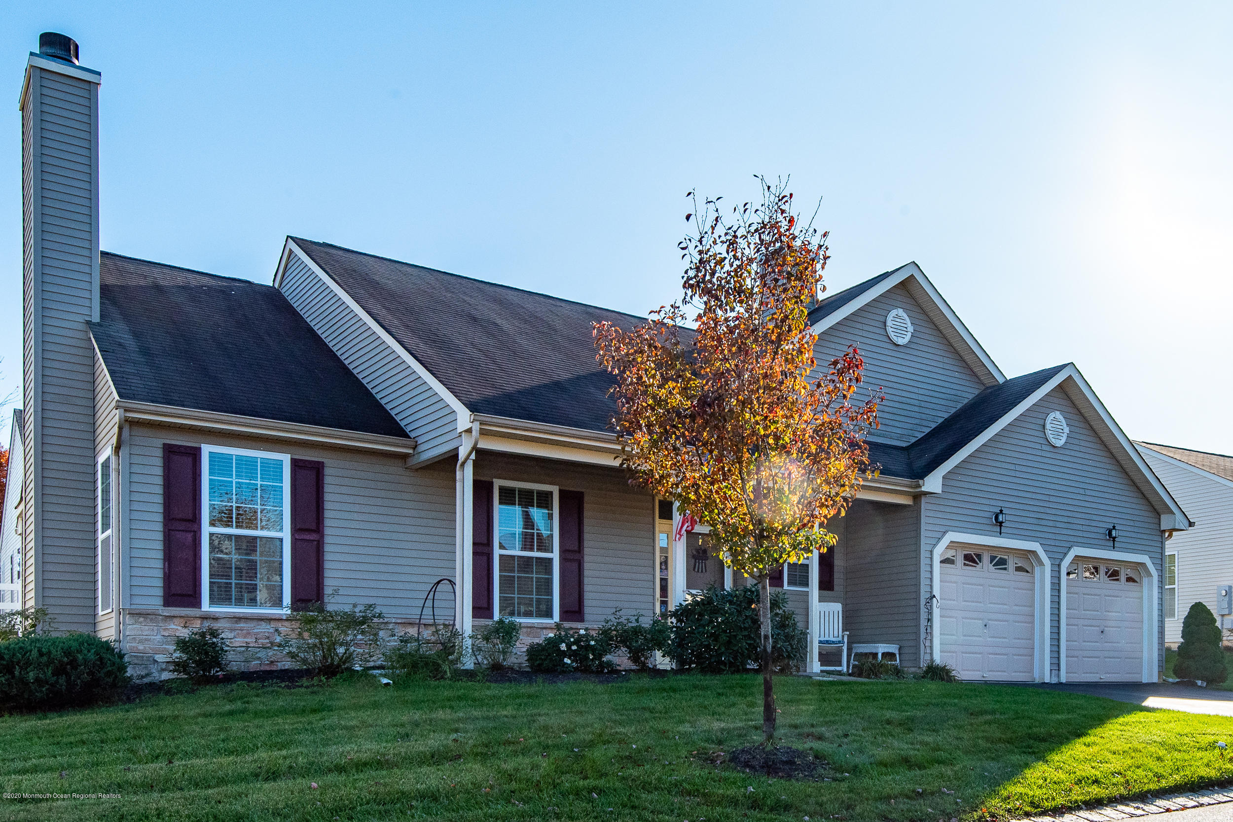 14 Tisdale Road Whiting, NJ 08759 - Photo 2 of 29 a front view of a house with a yard and garage
