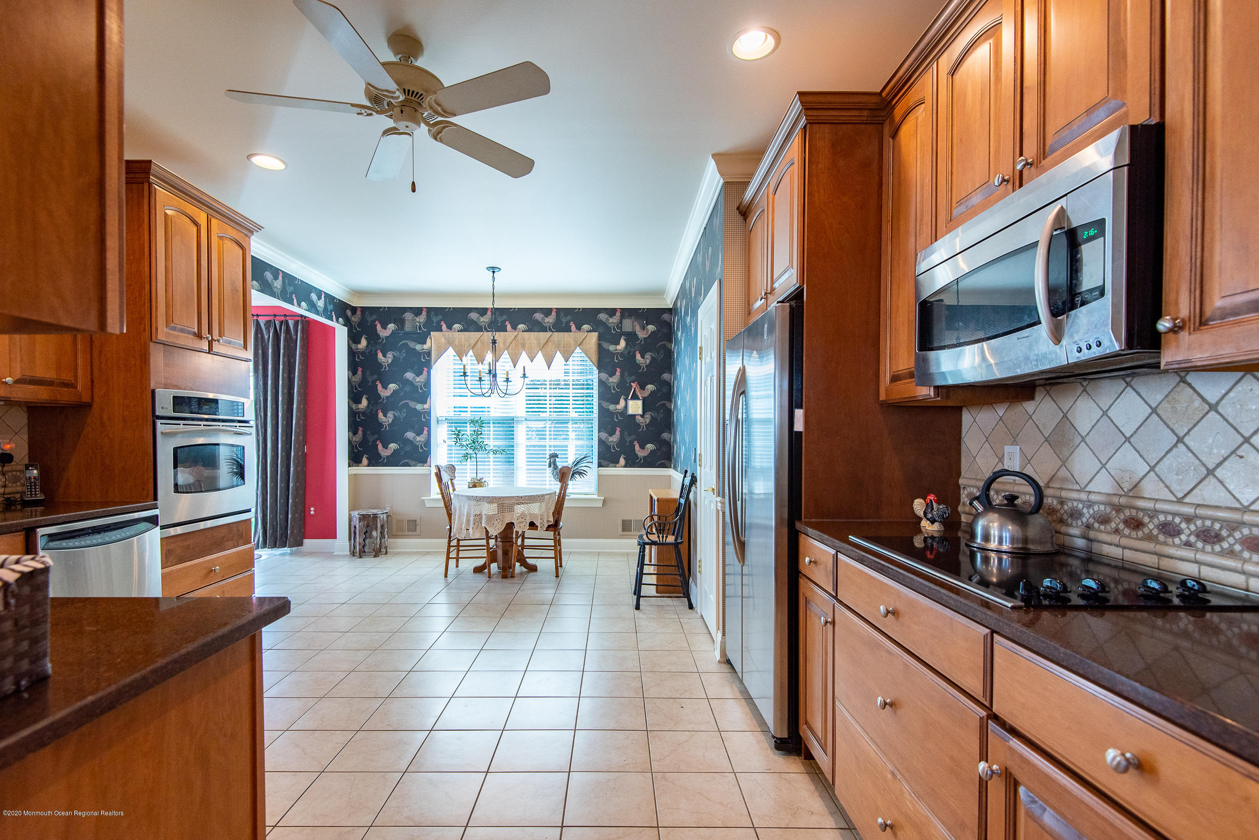 14 Tisdale Road Whiting, NJ 08759 - Photo 12 of 29 a open kitchen with stainless steel appliances granite countertop a stove a sink and a microwave
