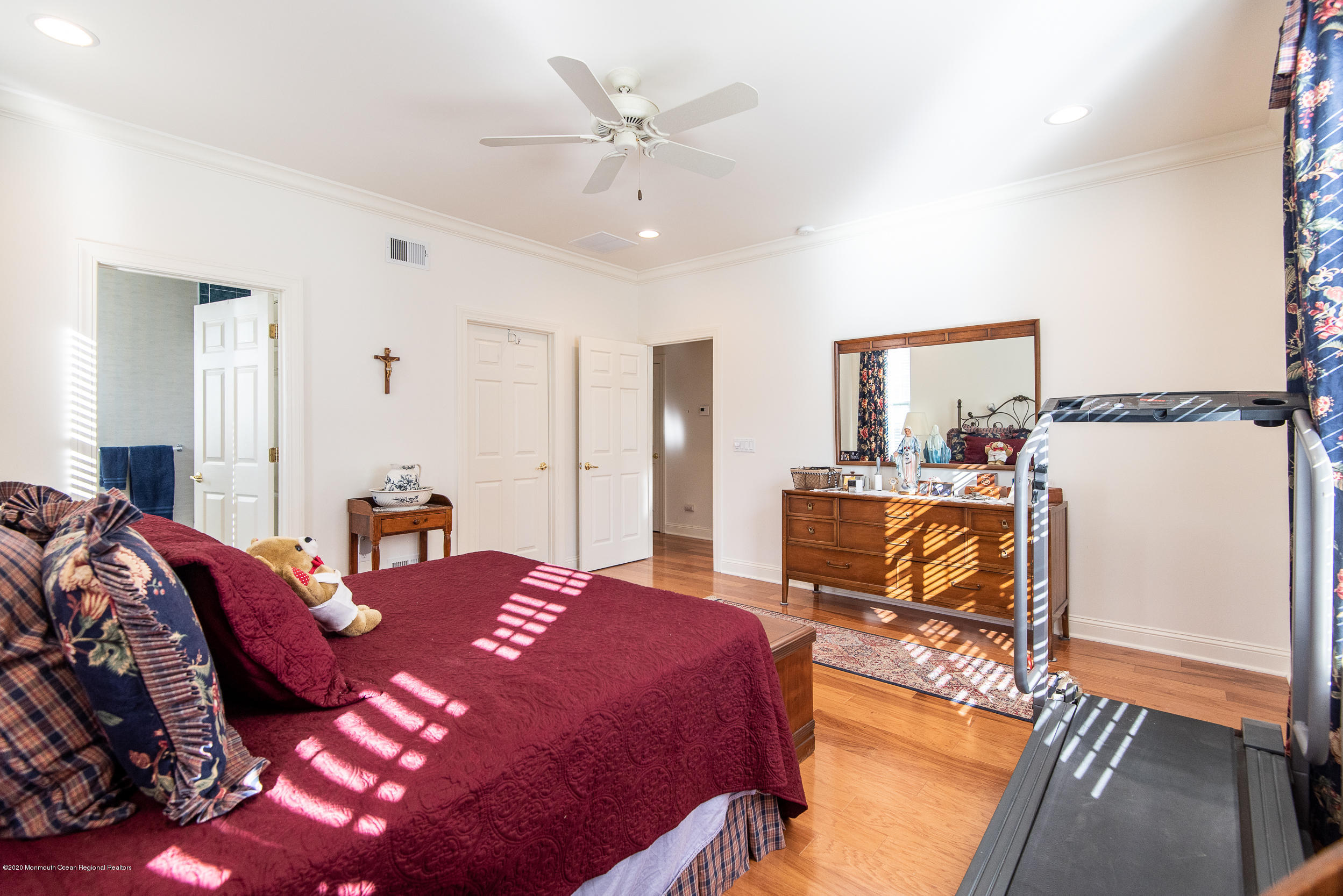 14 Tisdale Road Whiting, NJ 08759 - Photo 18 of 29 a bedroom with a bed a chandelier and a dresser