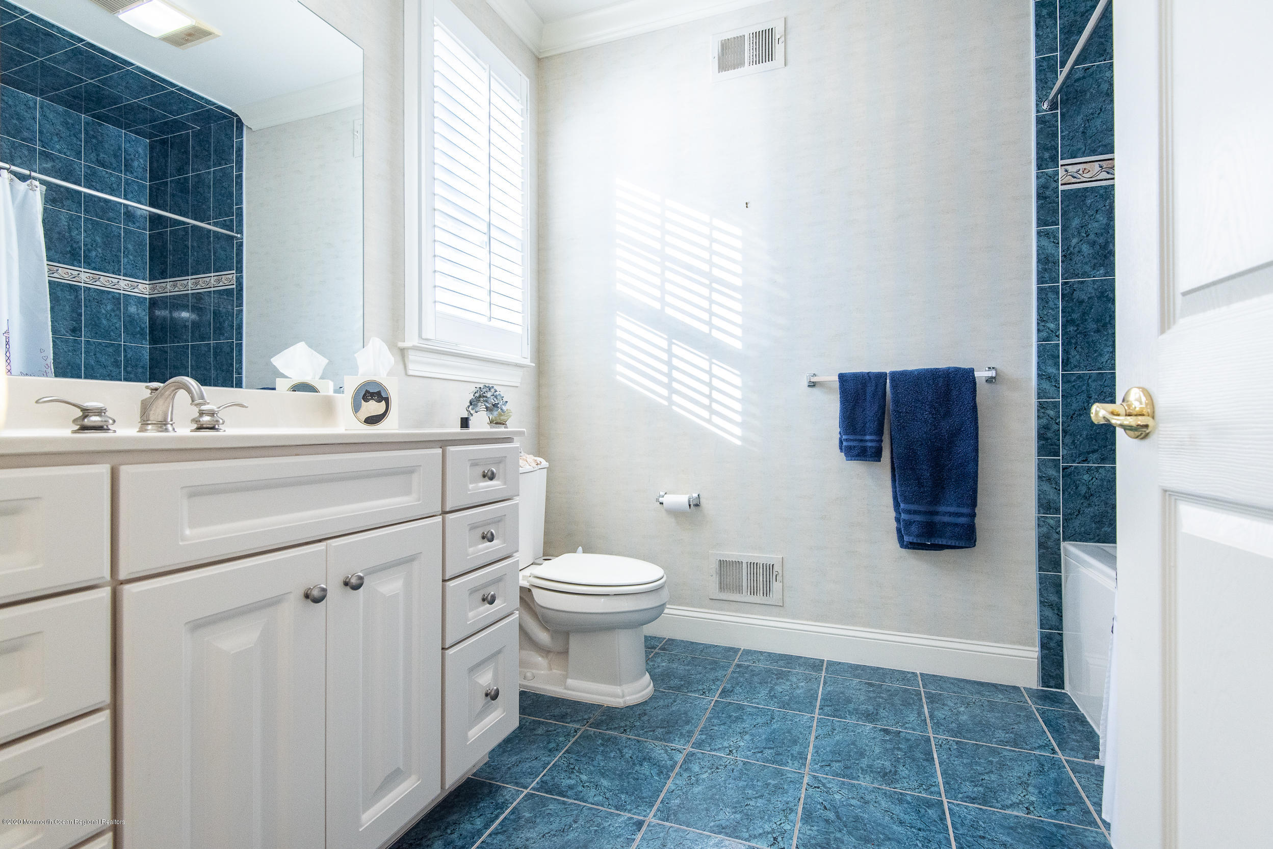 14 Tisdale Road Whiting, NJ 08759 - Photo 19 of 29 a bathroom with a toilet sink and a mirror