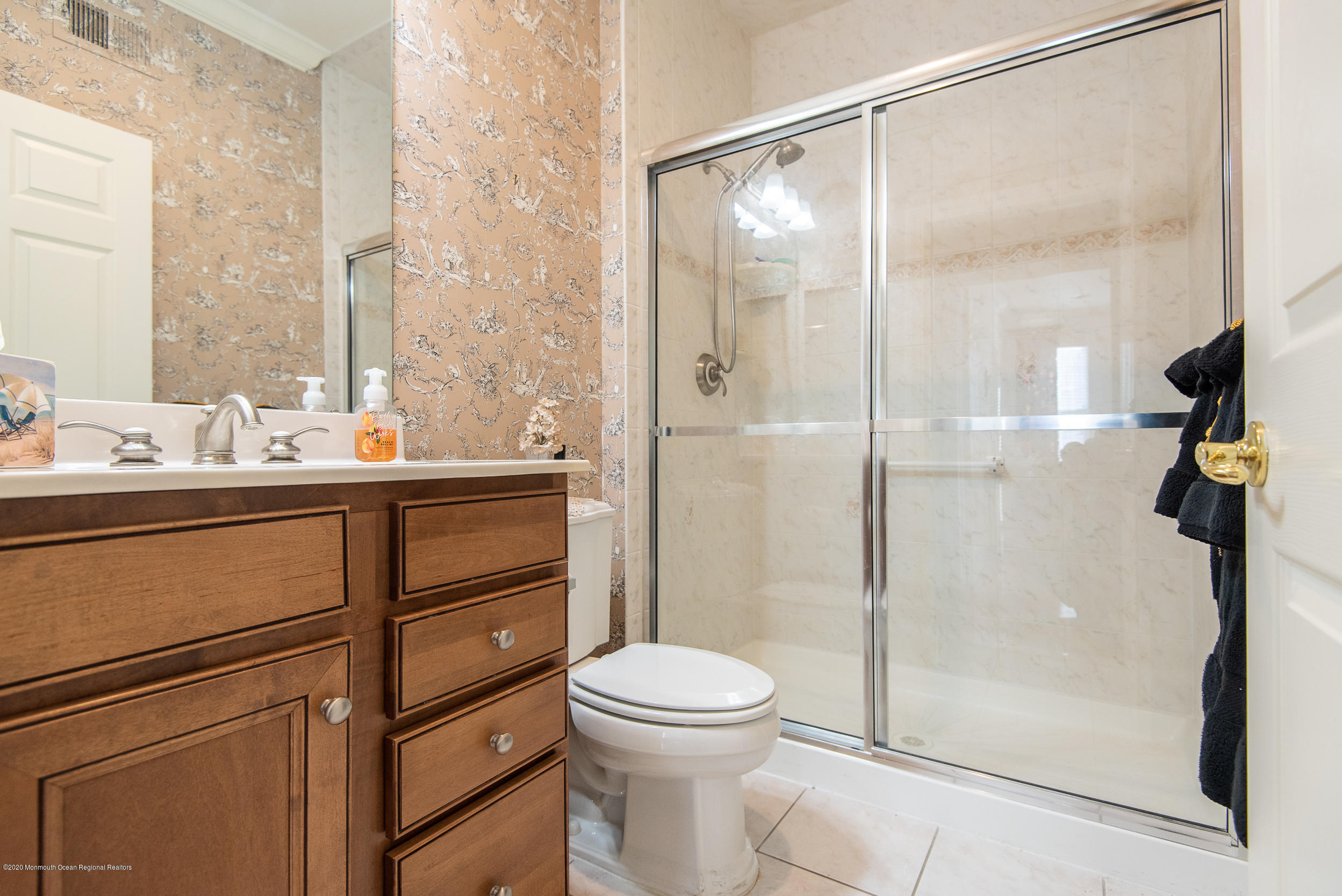 14 Tisdale Road Whiting, NJ 08759 - Photo 21 of 29 a bathroom with a sink a toilet and shower