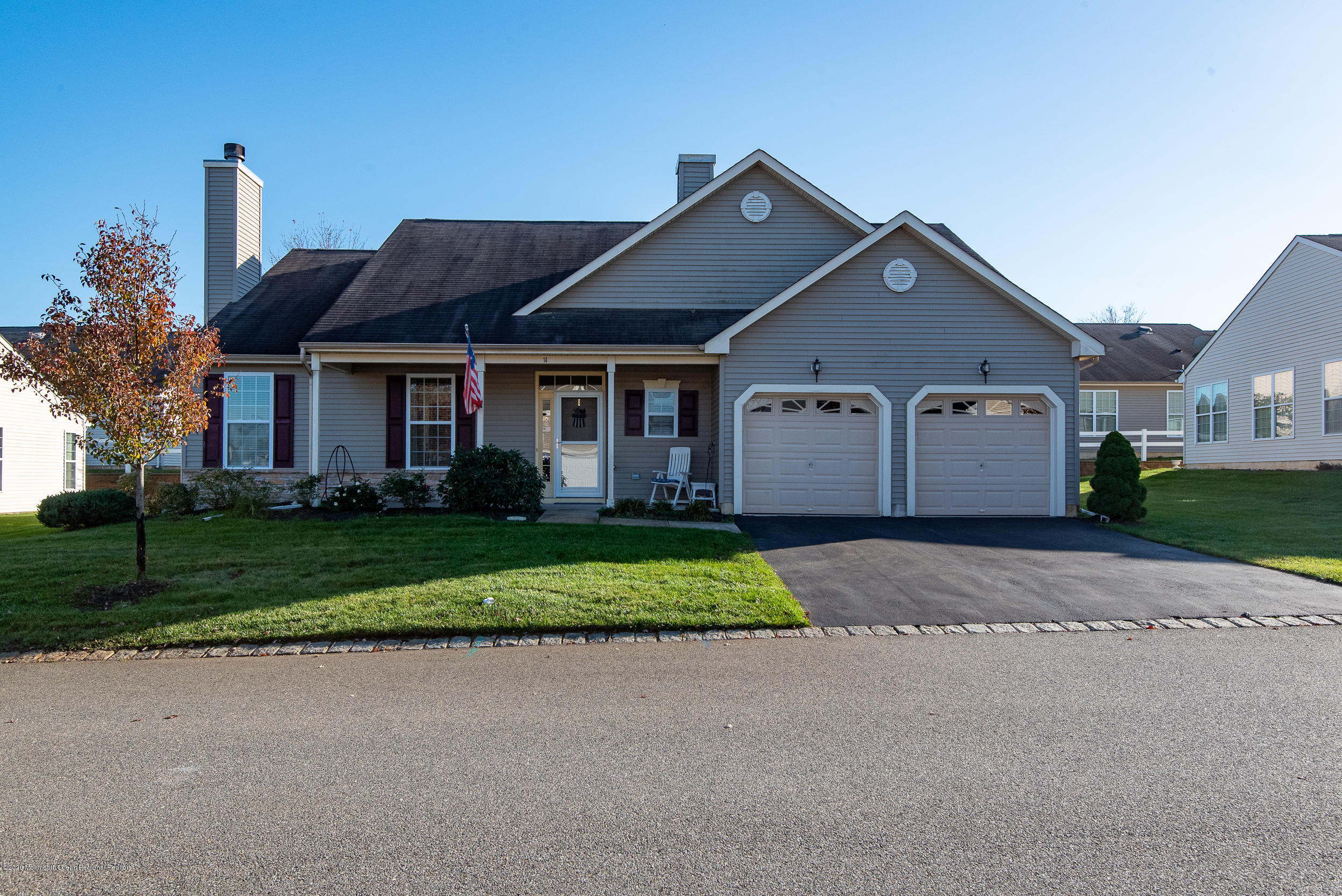14 Tisdale Road Whiting, NJ 08759 - Photo 23 of 29 a front view of a house with a yard and garage