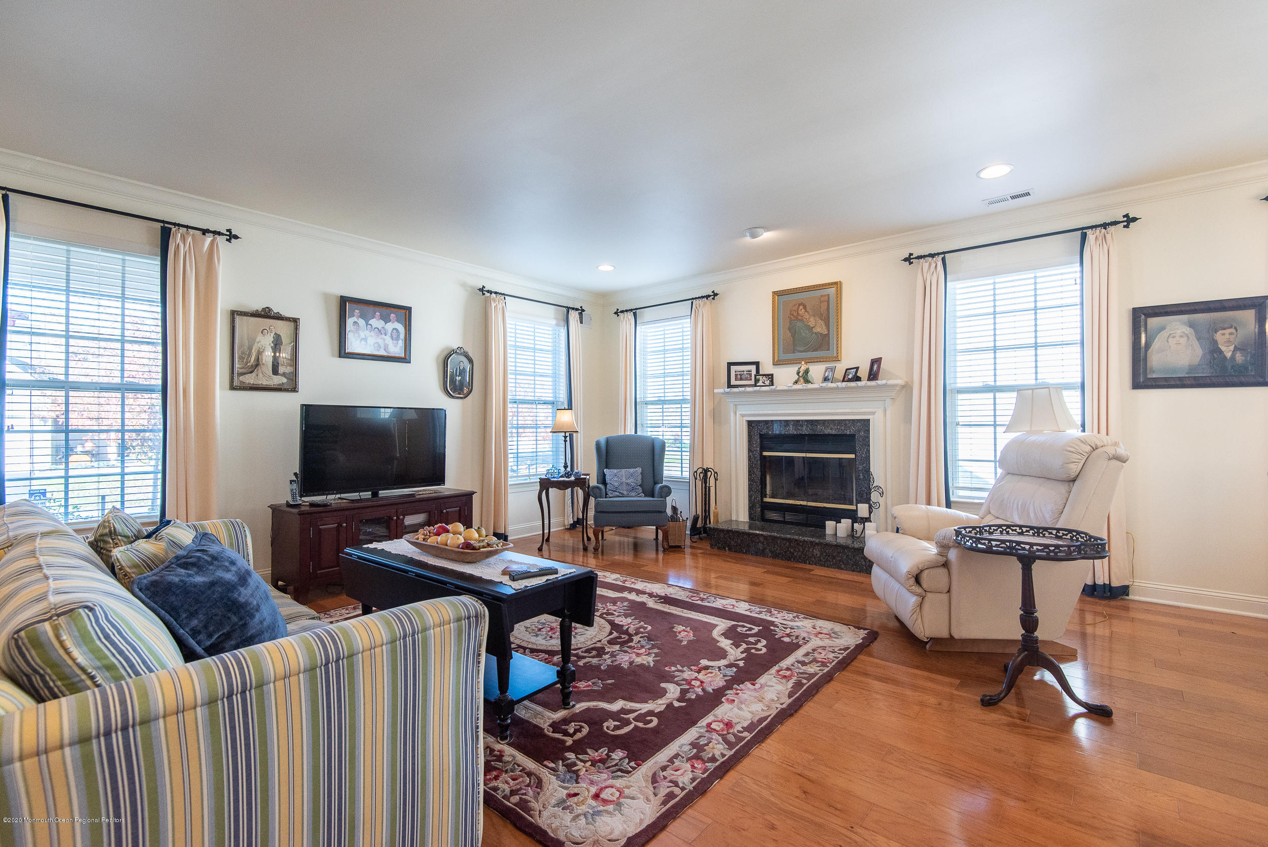 14 Tisdale Road Whiting, NJ 08759 - Photo 6 of 29 a living room with furniture a fireplace and a flat screen tv