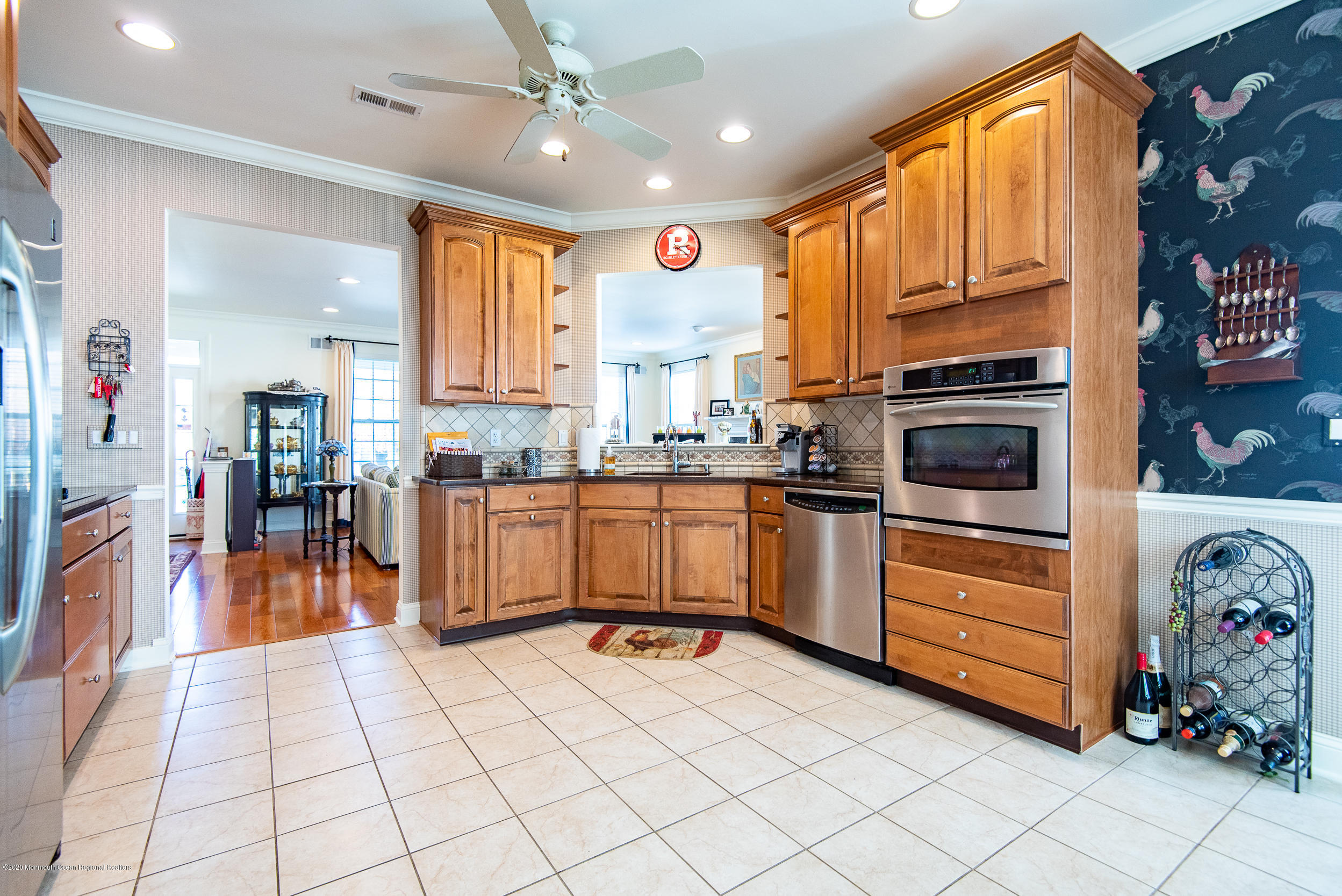 14 Tisdale Road Whiting, NJ 08759 - Photo 9 of 29 a kitchen with stainless steel appliances granite countertop a refrigerator a sink dishwasher and a stove with wooden cabinets