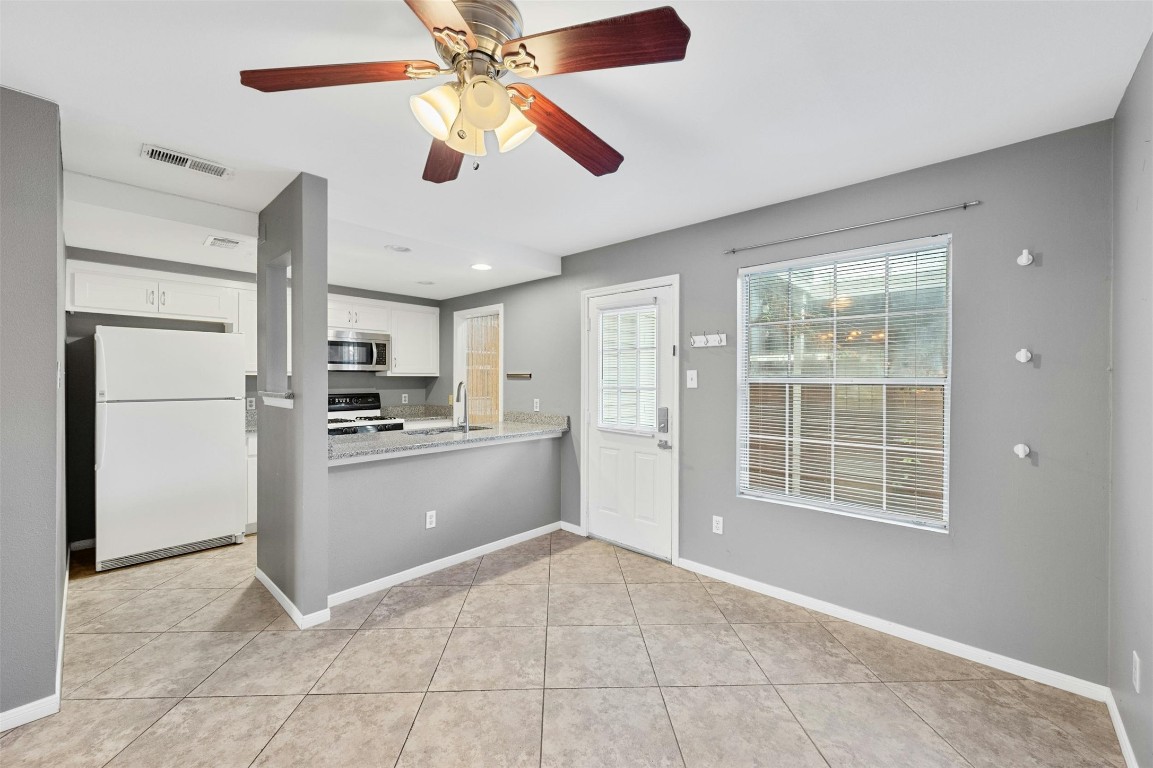 1904 Goodrich Avenue, Unit 4 Austin, TX 78704 - Photo 15 of 31 a large kitchen with cabinets and stainless steel appliances