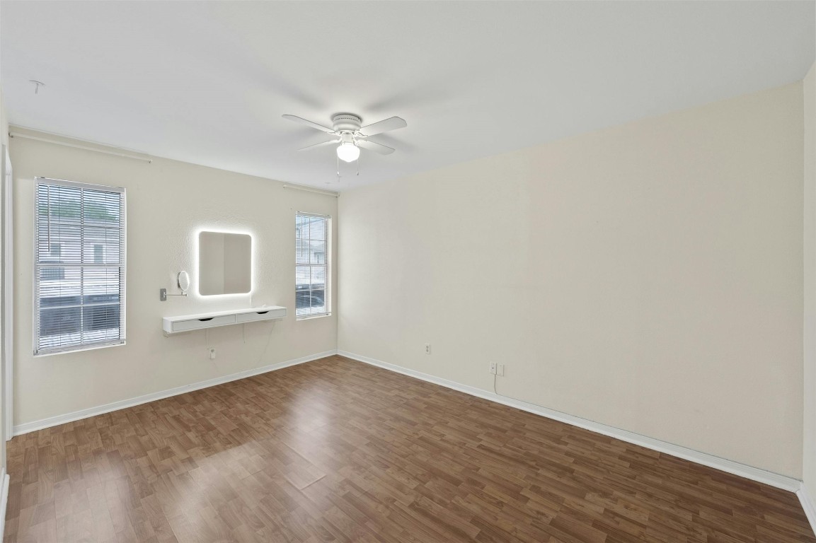 1904 Goodrich Avenue, Unit 4 Austin, TX 78704 - Photo 22 of 31 a view of empty room with wooden floor and fan