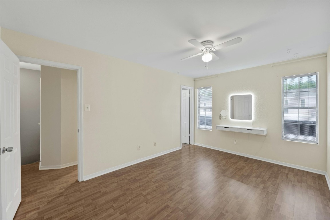 1904 Goodrich Avenue, Unit 4 Austin, TX 78704 - Photo 24 of 31 a view of an empty room with a window and wooden floor