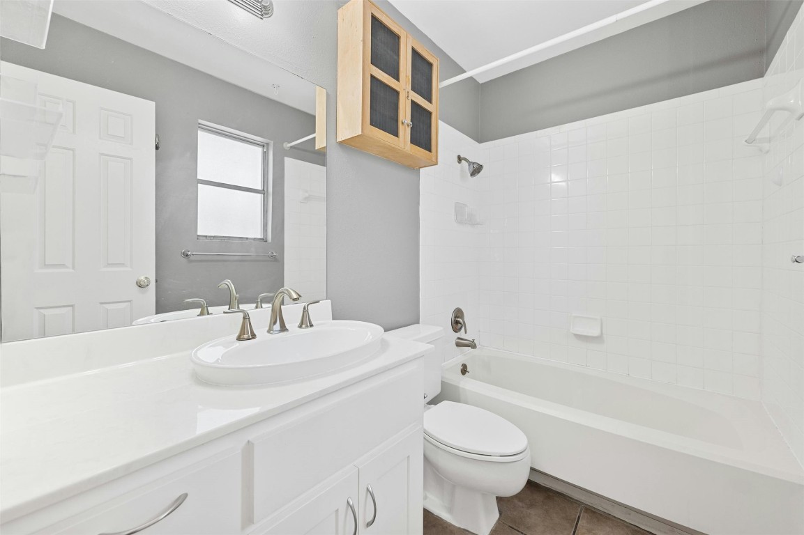 1904 Goodrich Avenue, Unit 4 Austin, TX 78704 - Photo 25 of 31 a bathroom with a sink a toilet and a bathtub