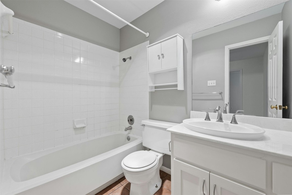 1904 Goodrich Avenue, Unit 4 Austin, TX 78704 - Photo 28 of 31 a bathroom with a sink toilet tub and shower