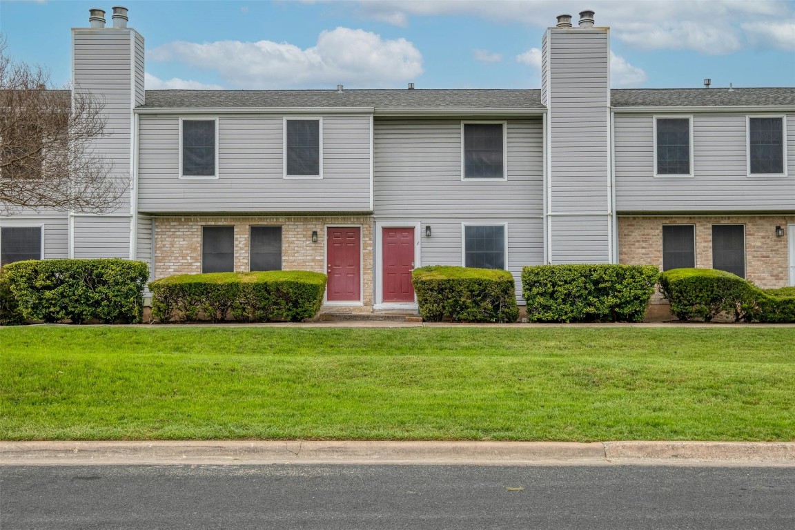 1904 Goodrich Avenue, Unit 4 Austin, TX 78704 - Photo 7 of 31 a front view of a house with a yard and garage