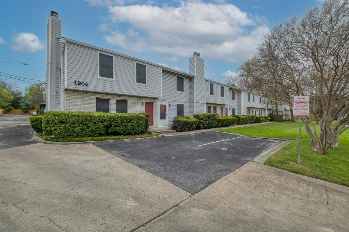 1904 Goodrich Avenue, Unit 4 Austin, TX 78704 - Photo 9 of 31 a front view of a house with a yard and garage