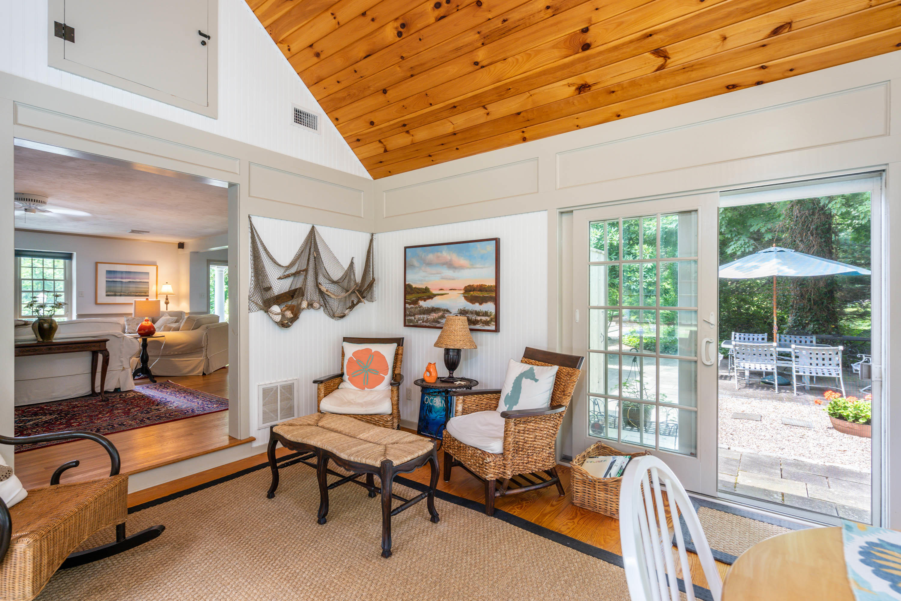 96 Breakwater Road Brewster, MA 02631 - Photo 12 of 16 a living room with furniture a table and a large window