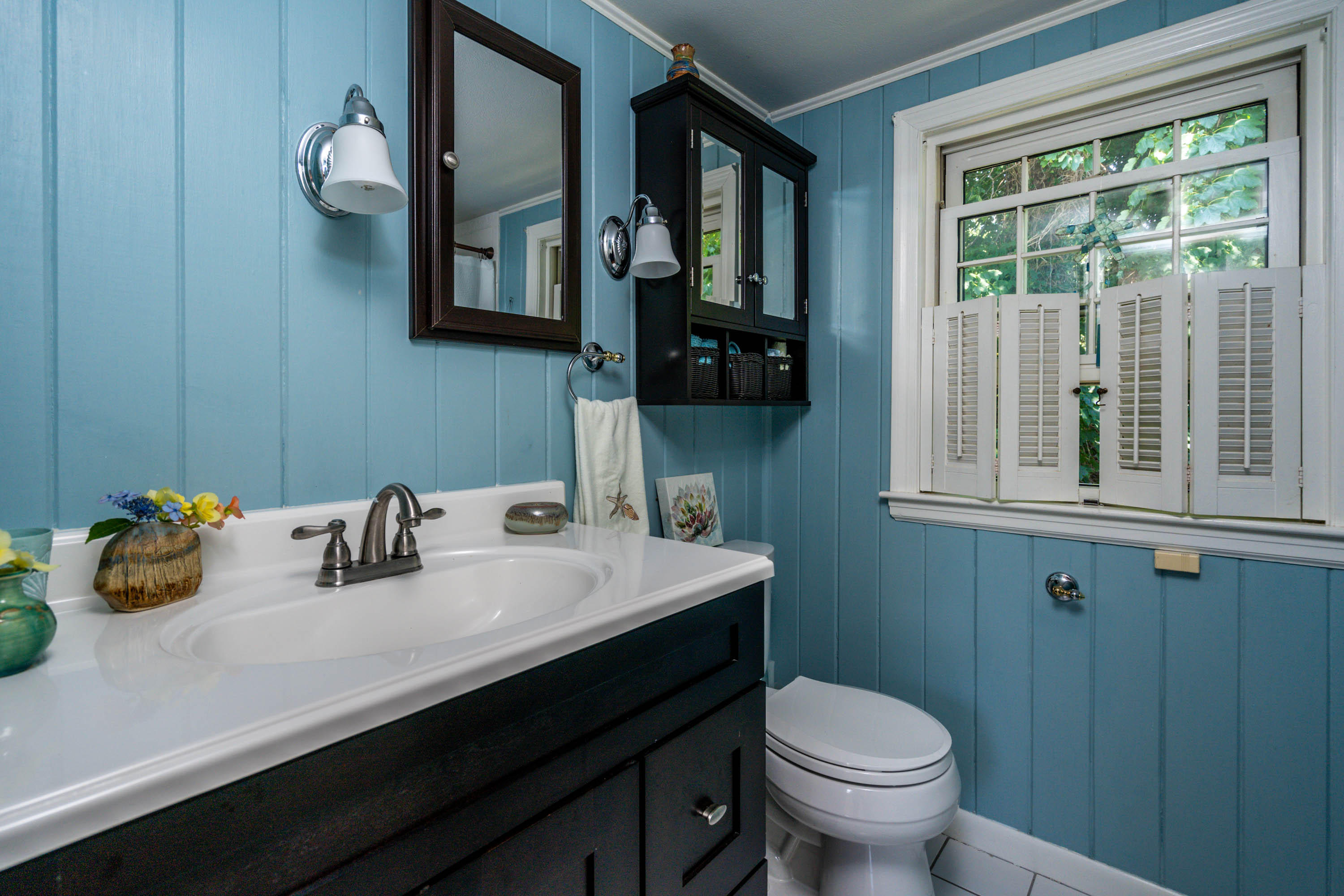 96 Breakwater Road Brewster, MA 02631 - Photo 13 of 16 a bathroom with a sink a mirror and a toilet
