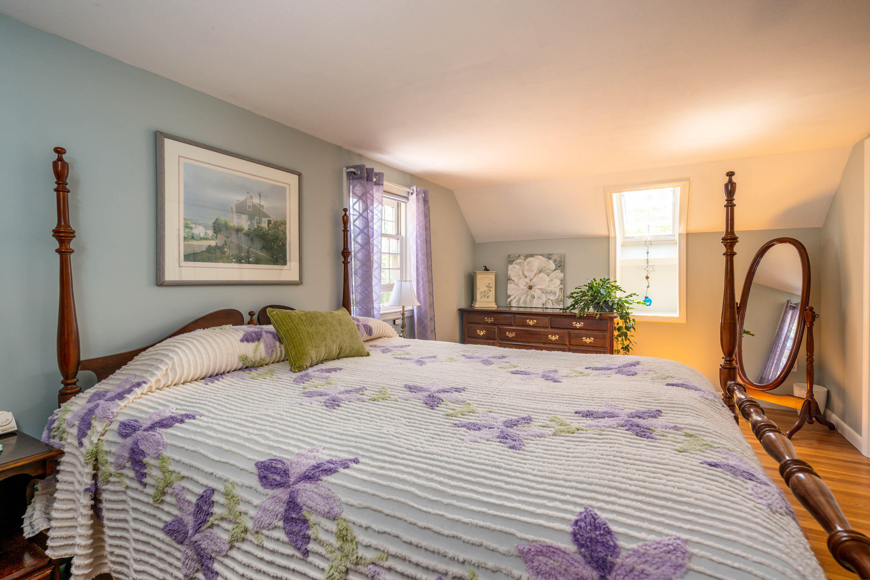 96 Breakwater Road Brewster, MA 02631 - Photo 14 of 16 a bedroom with a bed large mirror and furniture