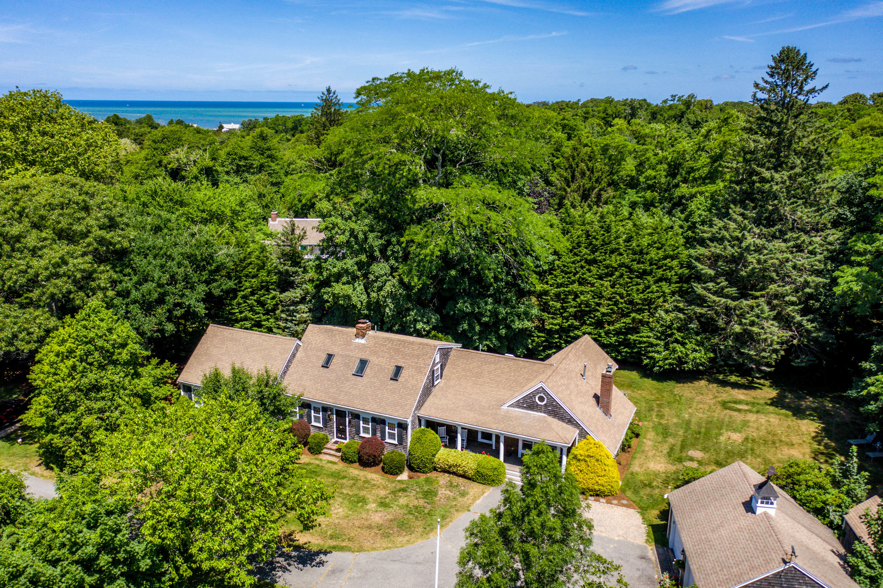 96 Breakwater Road Brewster, MA 02631 - Photo 2 of 16 an aerial view of a house with garden space and street view