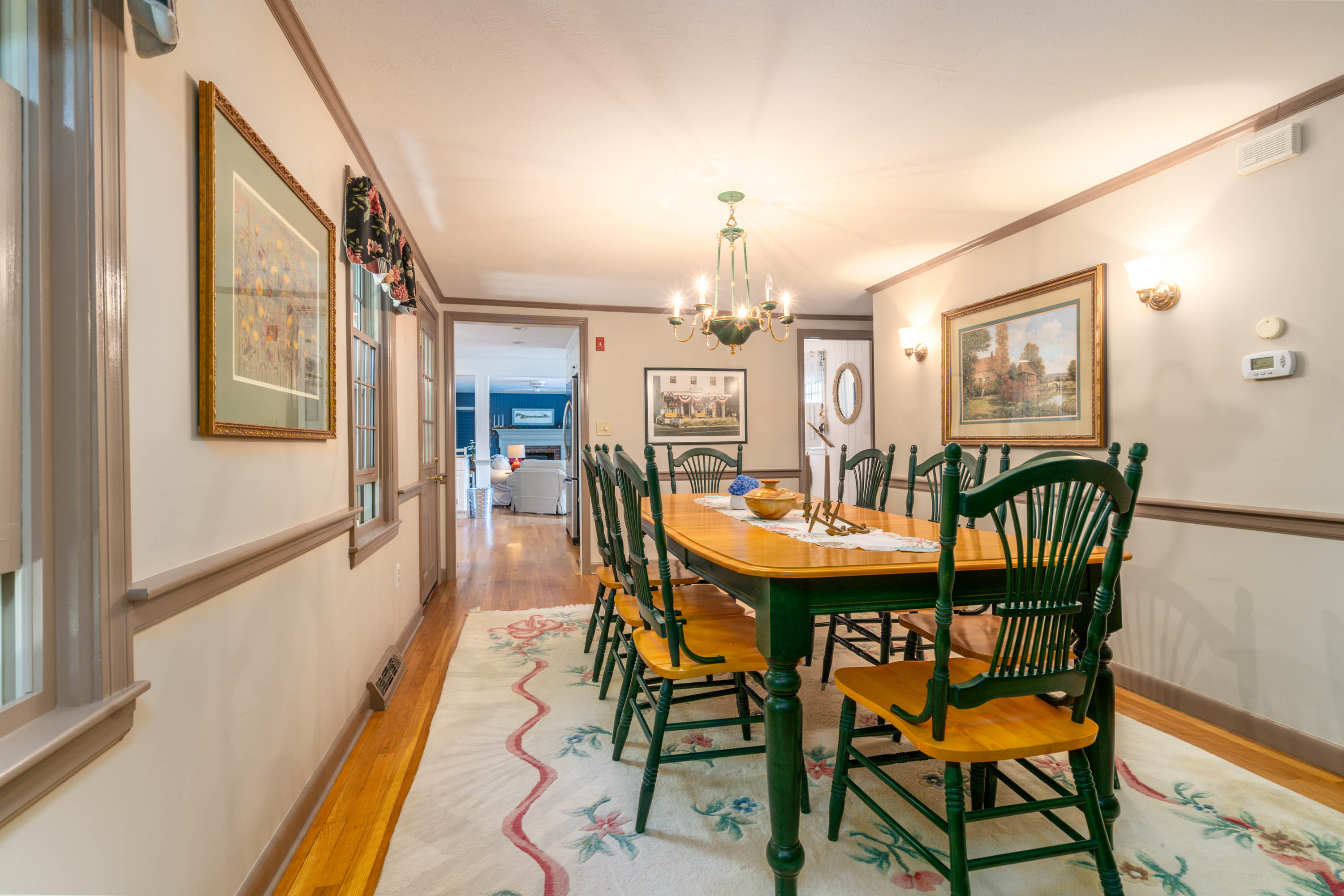 96 Breakwater Road Brewster, MA 02631 - Photo 6 of 16 a view of a dining room with furniture and wooden floor