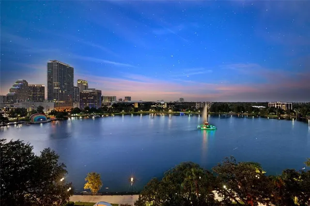 a large kitchen with stainless steel appliances kitchen island granite countertop a sink and a stove top oven