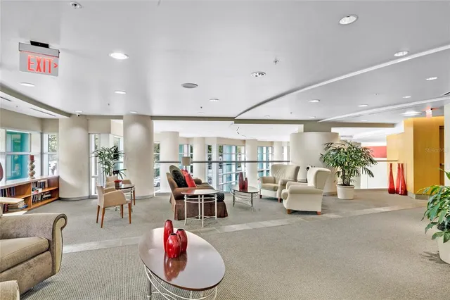 a swimming pool with outdoor seating and city view