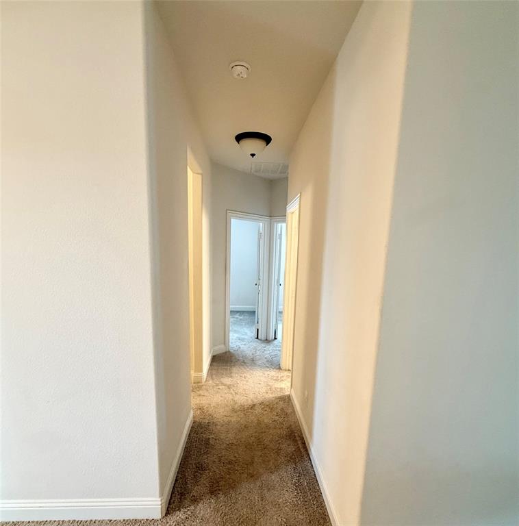 204 Flower Ridge Drive Fort Worth, TX 76108 - Photo 8 of 27 a view of a hallway with white door