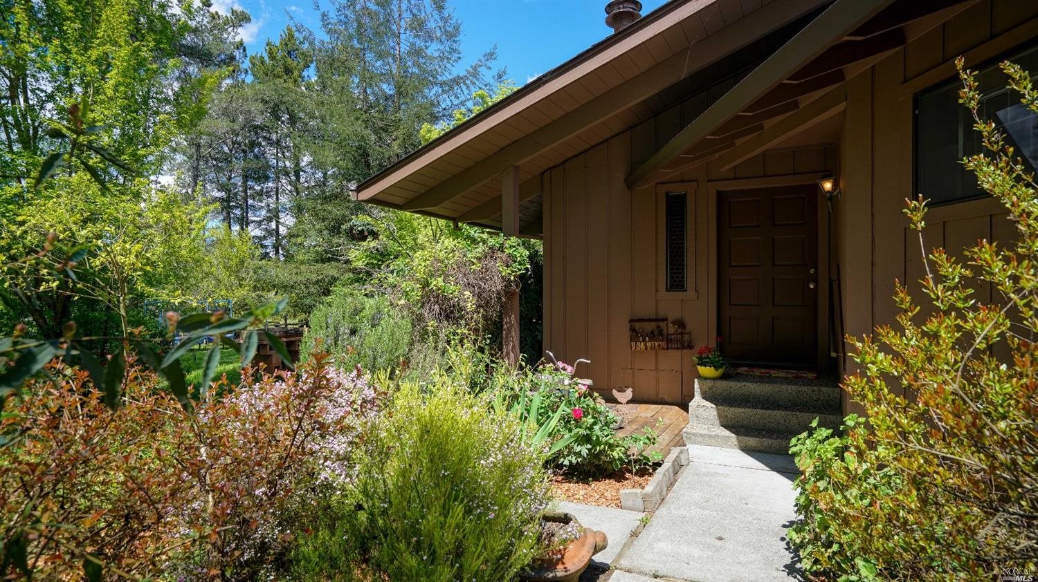 335 Sexton Road Sebastopol, CA 95472 - Photo 1 of 1 a couple of flower plants in front of door