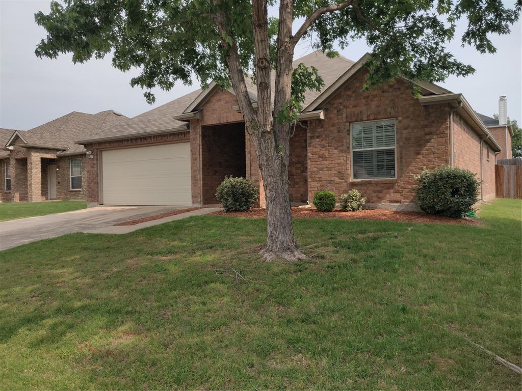 1917 Silver Leaf Drive Little Elm, TX 75068 - Photo 1 of 1 a front view of a house with a yard and garage
