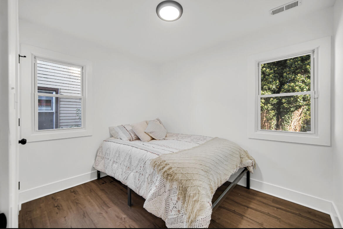 4514 East 10th Avenue Gary, IN 46403 - Photo 11 of 14 a bedroom with a bed and a window