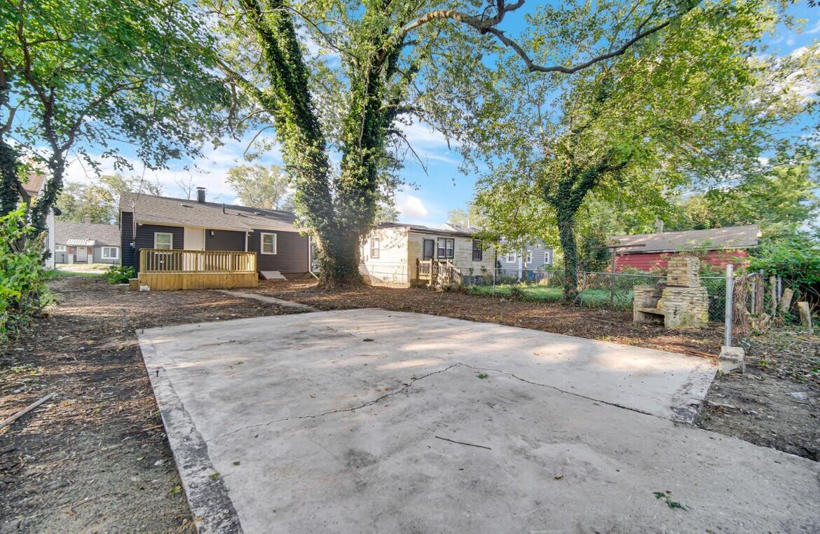 4514 East 10th Avenue Gary, IN 46403 - Photo 14 of 14 a view of a house with a yard and tree s