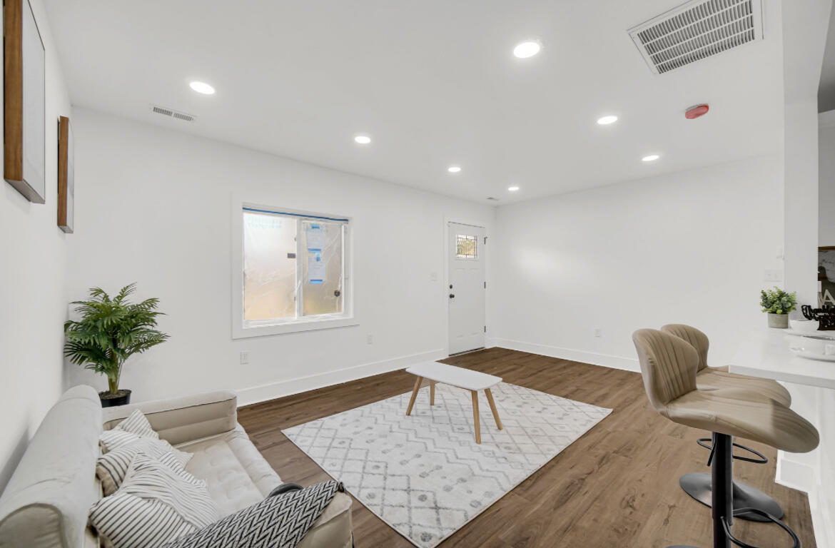 4514 East 10th Avenue Gary, IN 46403 - Photo 5 of 14 a living room with furniture and a potted plant