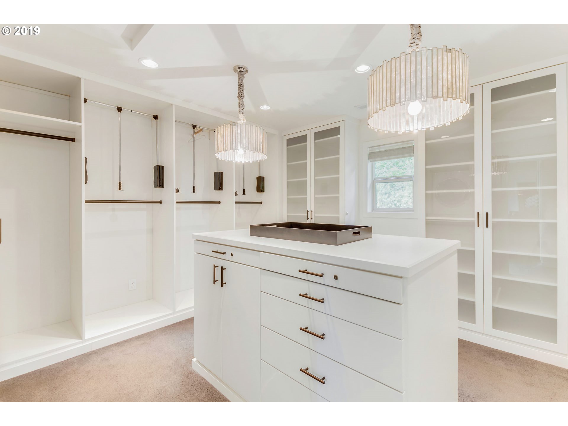 6534 Southwest View Point Terrace Portland, OR 97239 - Photo 18 of 29 a kitchen with granite countertop white cabinets and window